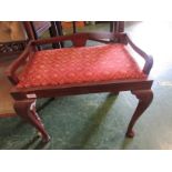 Mahogany framed piano stool with drop in upholstered seat.