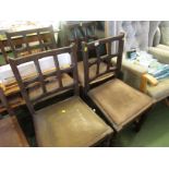 Set of four stained wooden dining chairs with drop-in seats