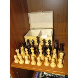 SET OF CARVED LIGHT AND DARK WOOD CHESS PIECES WITH BOX