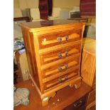 YEW VENEERED FOUR DRAWER BEDSIDE CABINET