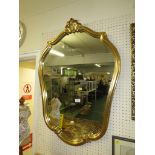 REPRODUCTION GILT FRAMED CARTOUCHE SHAPED WALL MIRROR