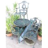 GREEN PAINTED CAST METAL GARDEN TABLE WITH FOUR MATCHING CHAIRS, PARASOL AND PARASOL STAND