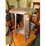 Hexagonal topped oak side table with stretchered shelf.