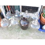 EIGHT GLASS DEMIJOHNS