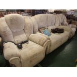 A Sherborne beige patterned three piece suite comprising two seater sofa, electric lift and rise