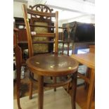 Mid wood side chair with embossed seat, and a light wood stool with vinyl seat