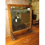 Oak framed wall mirror with shelf.