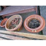 FOUR TERRACOTTA GARDEN POTS TOGETHER WITH FEET