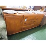 ERCOL LIGHT ELM SIDEBOARD WITH THREE CENTRAL DRAWERS AND CUPBOARD TO EITHER END, STANDING ON