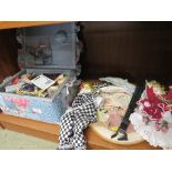 FABRIC CLAD SEWING BOX WITH CONTENTS, TWO NEEDLEWORK PANELS, TOURIST FAN AND TWO DECORATIVE DOLLS