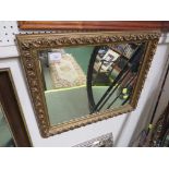 RECTANGULAR WALL MIRROR IN A MOULDED GILT EFFECT FRAME