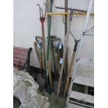 SELECTION OF LONG HANDLED TOOLS INCLUDING PICKS, SLEDGEHAMMER, RAKES, PITCH FORK ETC