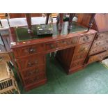 BRIGHTS OF NETTLEBED MAHOGANY VENEERED PEDESTAL DESK WITH NINE DRAWERS AND GREEN LEATHER SCRIBER