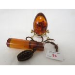 VICTORIAN AMBER PARASOL OR UMBRELLA HANDLE WITH INCLUSIONS, AND AN AMBER STYLE RESIN EGG WITH