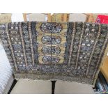SMALL RECTANGULAR BEIGE GROUND MIDDLE EASTERN STYLE RUG WITH TWELVE MEDALLIONS