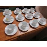 SET OF TWELVE SPANISH PORCELAIN COFFEE CUPS AND SAUCERS