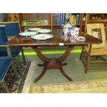 VICTORIAN MAHOGANY FOLD OVER TEA TABLE ON SCROLL SUPPORTS CARVED WITH LAUREL LEAVES AND A