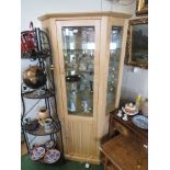 ILLUMINATED LIGHT OAK VENEERED CORNER DISPLAY CABINET WITH GLAZING AND MIRRORED INTERIOR