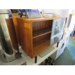 TWO LOW TEAK BOOKCASES WITH SLIDING GLASS DOORS