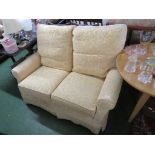 TWO SEATER SOFA IN PALE YELLOW COVERS