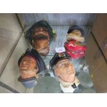 FOUR BOSSONS PAINTED PLASTER WALL MASKS