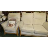 LIGHT WOOD FRAMED TWO SEATER SOFA AND ONE ARMCHAIR IN CREAM UPHOLSTERY