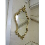 MODERN WALL MIRROR IN A GILT CARTOUCHE-SHAPE FRAME