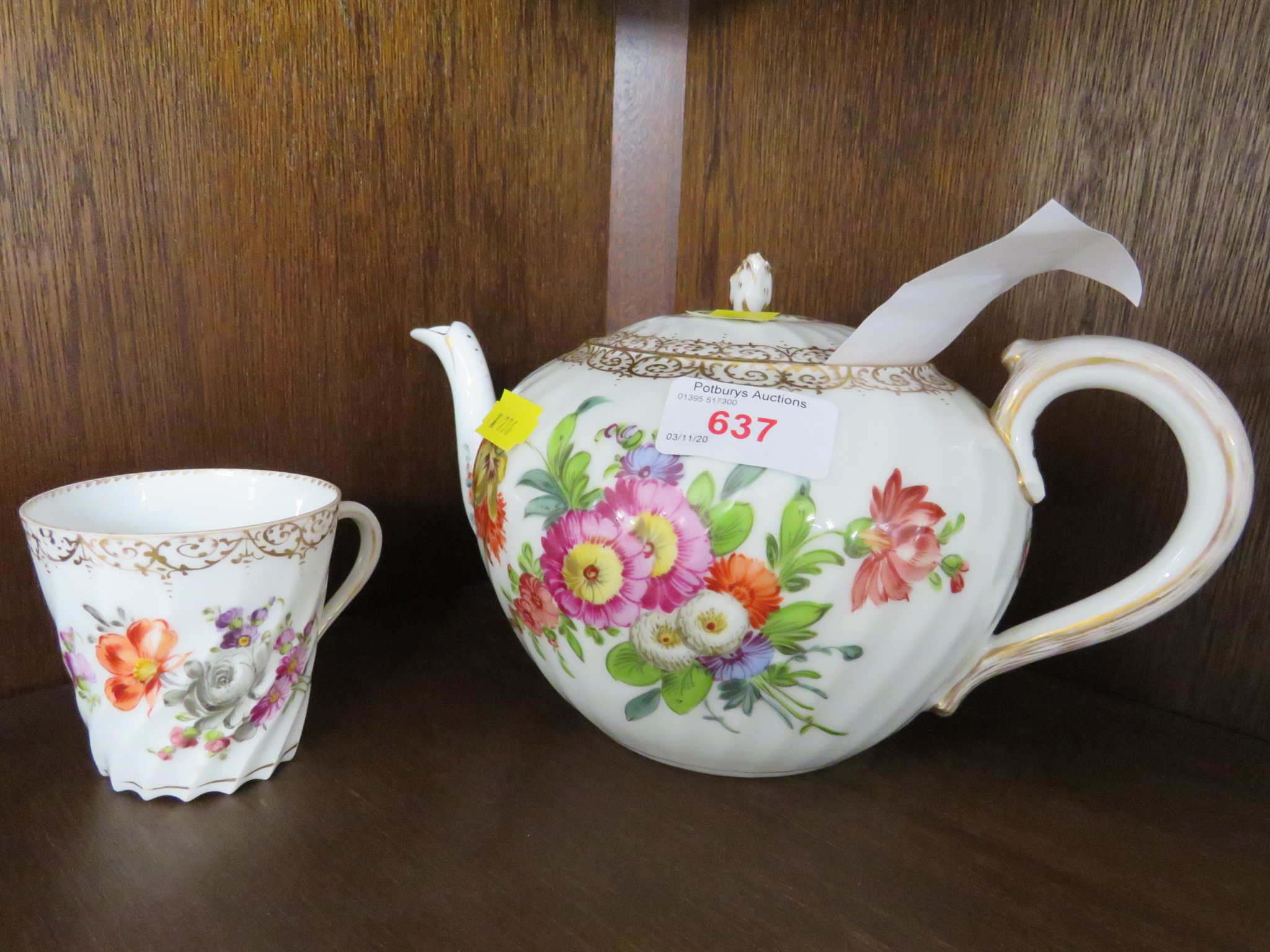 A DRESDEN PORCELAIN TEAPOT PAINTED IN FLOWERS, AND A DRESDEN WRYTHEN CUP