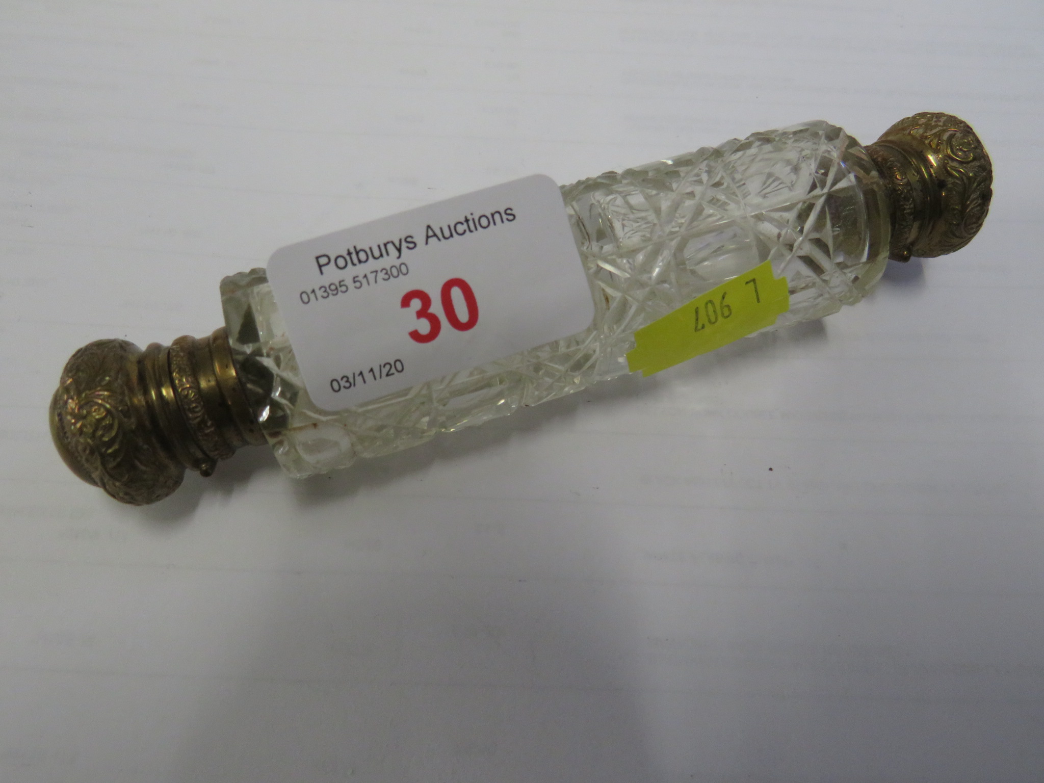 CLEAR CUT GLASS DOUBLE-ENDED SCENT BOTTLE WITH GILT BRASS MOUNTS, BOTH STOPPERS PRESENT, LENGTH 14.