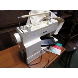 SINGER ELETRIC SEWING MACHINE 6215C WITH MANUAL AND COVER (NEEDS PLUG)