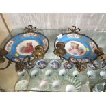 A PAIR OF SEVRES PORCELAIN HAND-PAINTED PLATES DEPICTING A PORTRAIT OF A MAN AND WOMAN WITH FLORAL