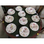 EARLY 20TH CENTURY TEA WARE AND SERVING PLATES IN A COLOURFUL FOLIATE PATTERN