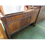 1940S STAINED OAK SIDEBOARD WITH TWO DRAWERS AND BRASS PEAR-DROP HANDLES