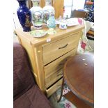 TALL LIGHTWOOD CHEST OF FOUR DOORS WITH BURNISHED BRASS HANDLES