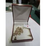 9 CARAT GOLD SPRAY BROOCH SET WITH TWENTY SEED PEARLS AND SEVEN SMALL GARNETS, BRITISH HALLMARKS,