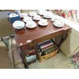 MAHOGANY FOLDING TEA TABLE WITH CARVED CABRIOLE LEGS AND BALL AND CLAW FEET