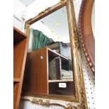 RECTANGLULAR BEVEL EDGED WALL MIRROR IN A GILT EFFECT FRAME