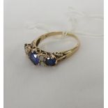 A SAPPHIRE AND PEARL RING WITH SHANK INDISTINCTLY STAMPED 9CT, SET WITH A CENTRAL PALE SAPPHIRE (