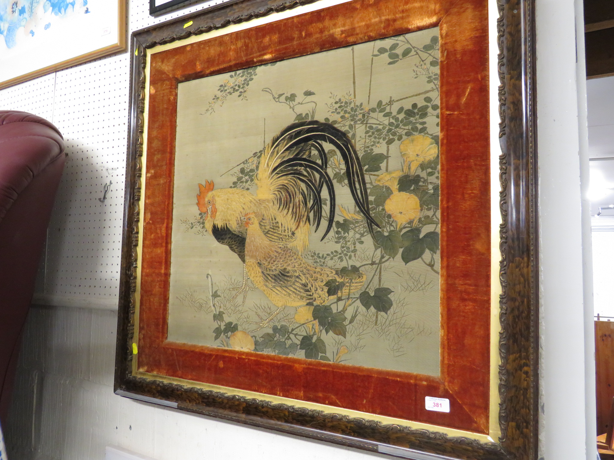 LARGE FAR EASTERN STYLE FABRIC PRINT OF HEN AND COCKEREL IN A WALNUT EFFECT FRAME WITH GILT BORDER