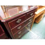 TELEVISION CABINET IN A MAHOGANY VENEER MODELLED AS A CHEST OF DRAWERS