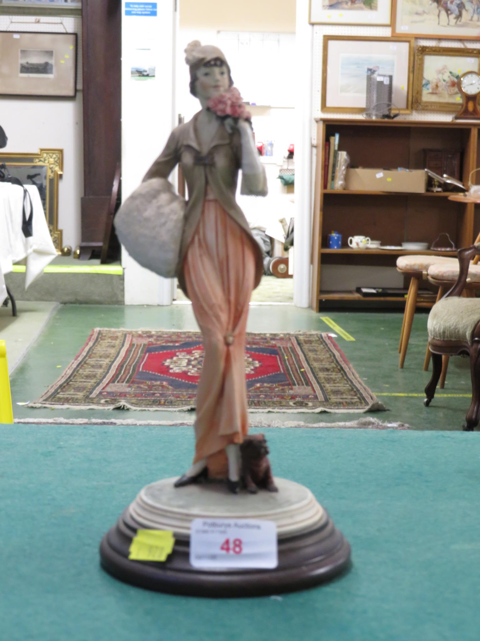RESIN FIGURE OF LADY WITH PUG DOG, IMPRESSED MARKS, ON WOODEN BASE MARKED MADE IN ITALY WITH THE