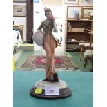 RESIN FIGURE OF LADY WITH PUG DOG, IMPRESSED MARKS, ON WOODEN BASE MARKED MADE IN ITALY WITH THE