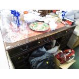 NINE-DRAWER MAHOGANY PEDESTAL DESK WITH A WORN RED LEATHER SCRIBER