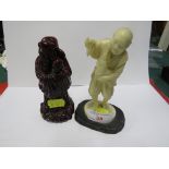 CHINESE STYLE RESIN FIGURE OF MAN WITH CHICKEN, AND DARK RED RESIN FIGURE OF ROBED WISE MAN WITH