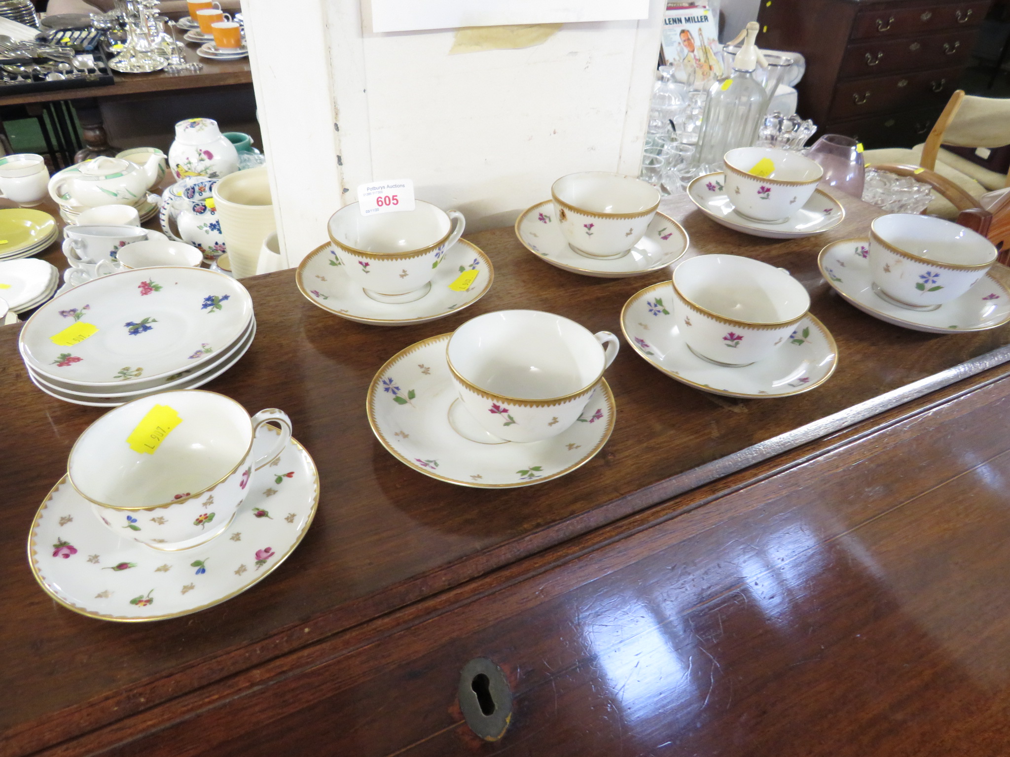 GERMAN PORCELAIN COFFEE CUPS DECORATED WITH FLOWERS AND WEDGWOOD CUPS AND SAUCERS