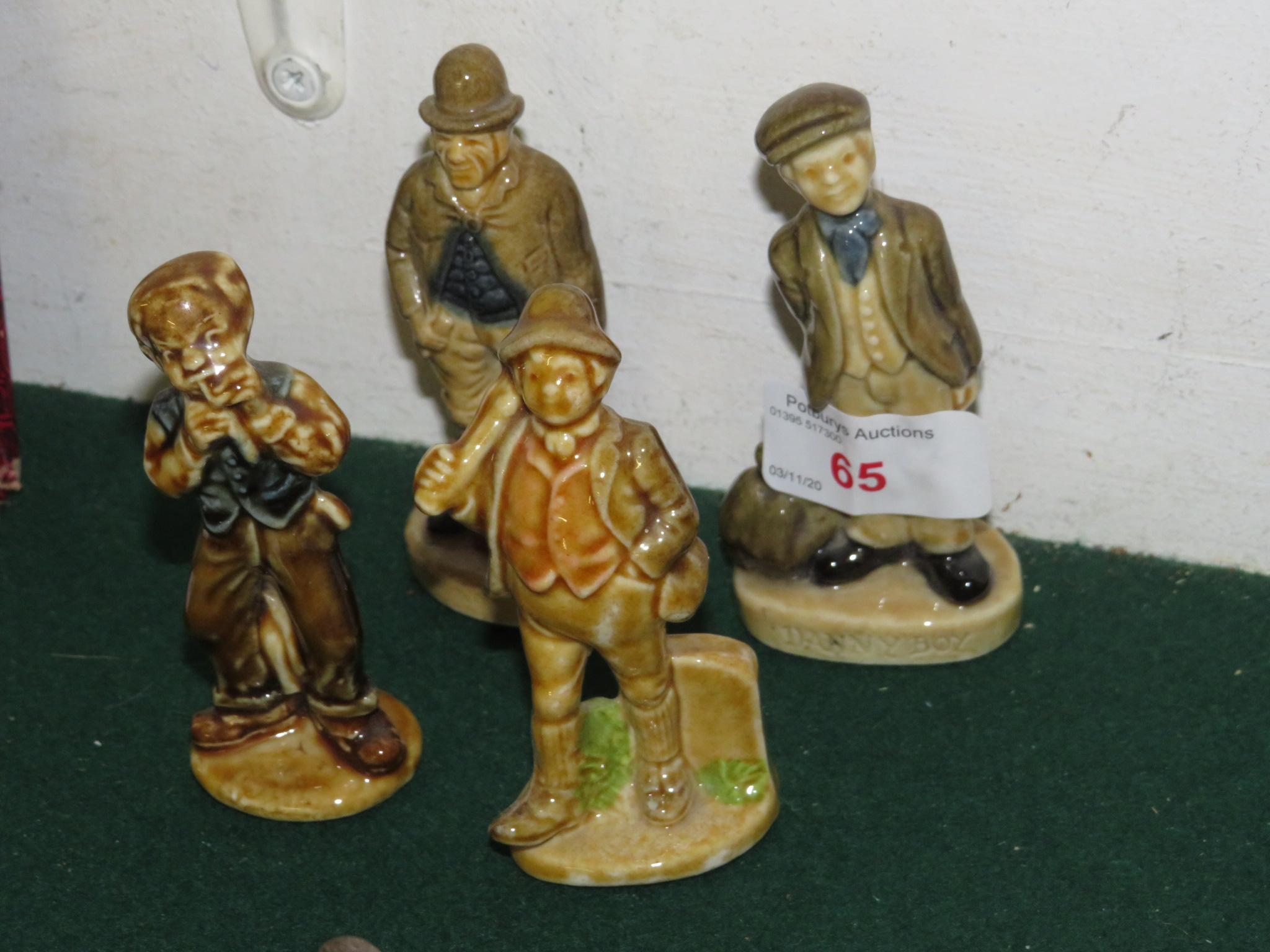 FOUR GLAZED POTTERY FIGURES, DANNY BOY ETC, STAMPED MADE IN GERMANY