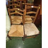 PAIR OF OAK FRAMED RUSH SEATED LADDER BACK CHAIRS TOGETHER WITH TWO OTHER RUSH-SEATED CHAIRS