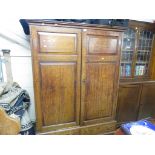 LATE 19TH CENTURY OAK WARDROBE WITH TWO PANELLED DOORS AND TWO DRAWERS UNDER
