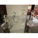 FOUR GLASS SCENT BOTTLES, INCLUDING ONE WITH A SILVER COLLAR (A/F)