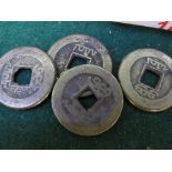 FOUR FAR EASTERN BRASS COINS